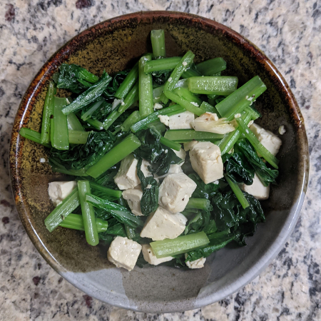 a bowl of yu choy and tofu